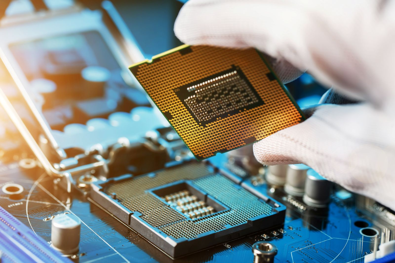 Technician installing a semiconductor processor